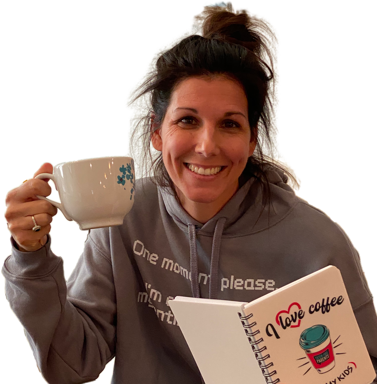 Meredith Masony drinking coffee with her 'I Love Coffee + my kids' notebook in 'one moment please' cropped Hoodie from her official merch line with Bonfire