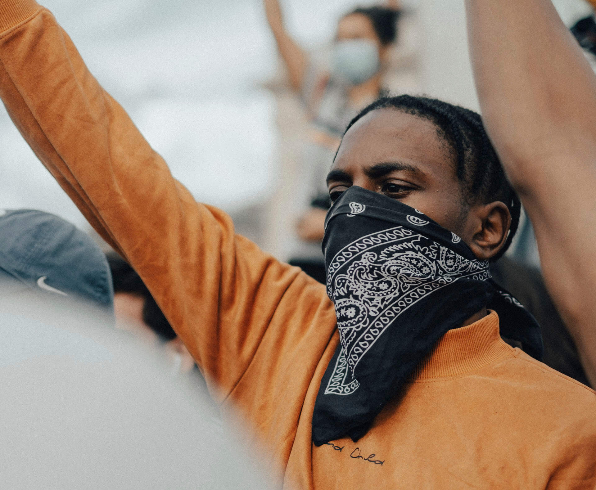 Black man with first in the air