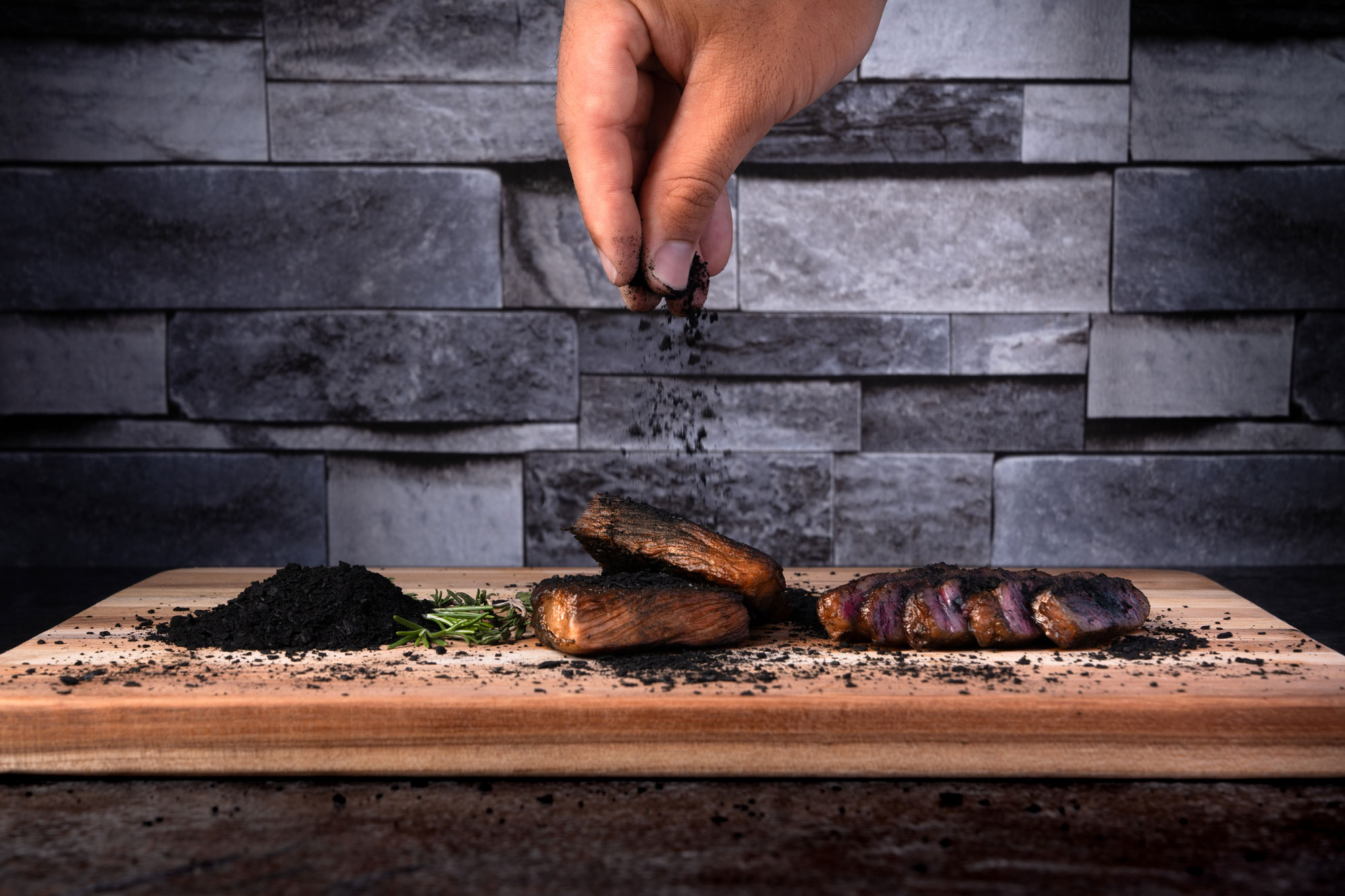 Person Sprinkling Sumi Shio Wagyu Beef Dry Rub Seasoning on Cooked Wagyu Beef Steak
