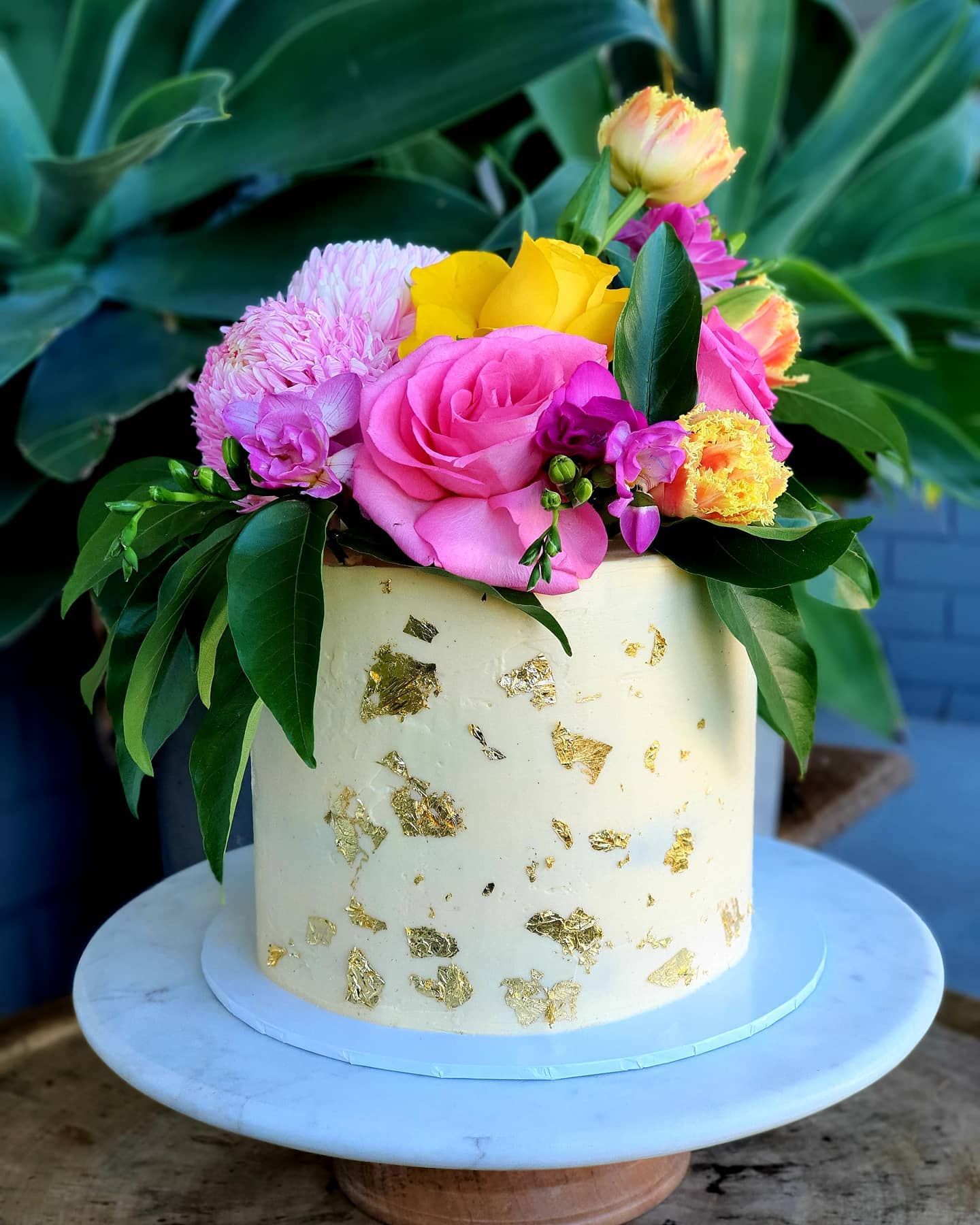 Ruby's cafe and gift store cake with flowers on top
