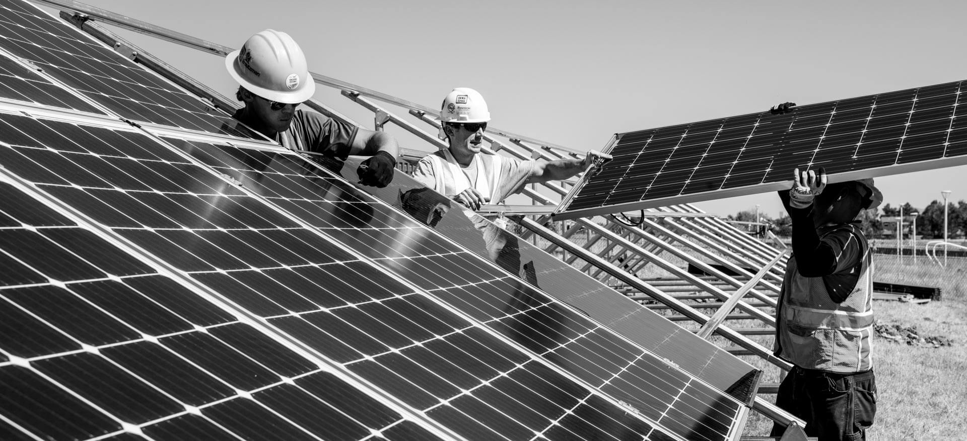 Men installing solar panels.