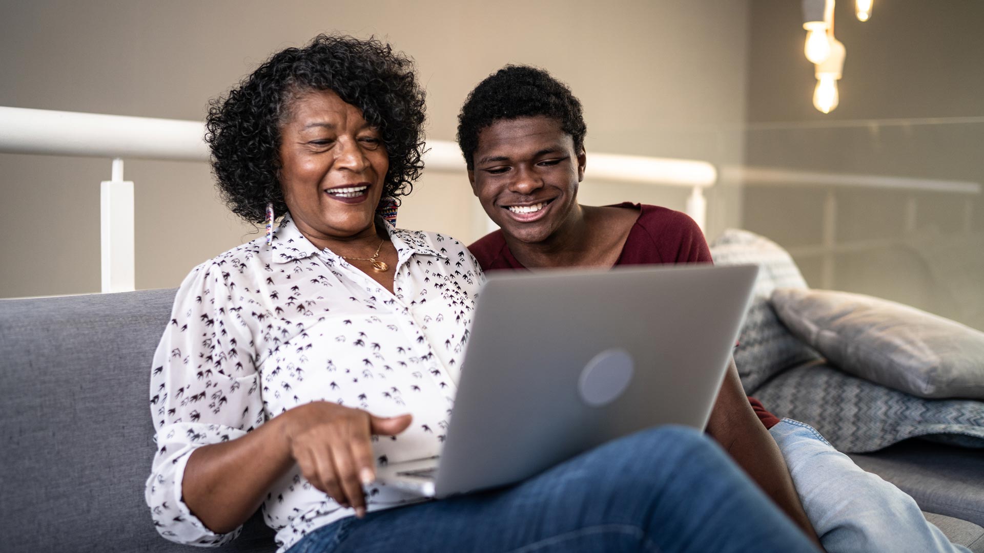 Mother and son looking at computer together.