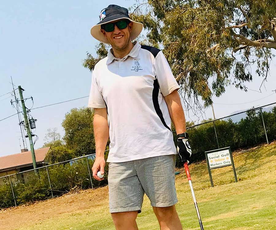 Man on white shirt playing sport