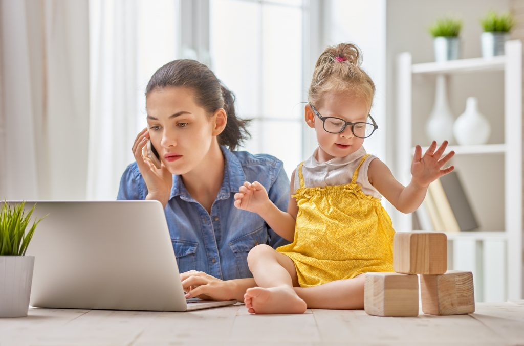 mother with toddler working