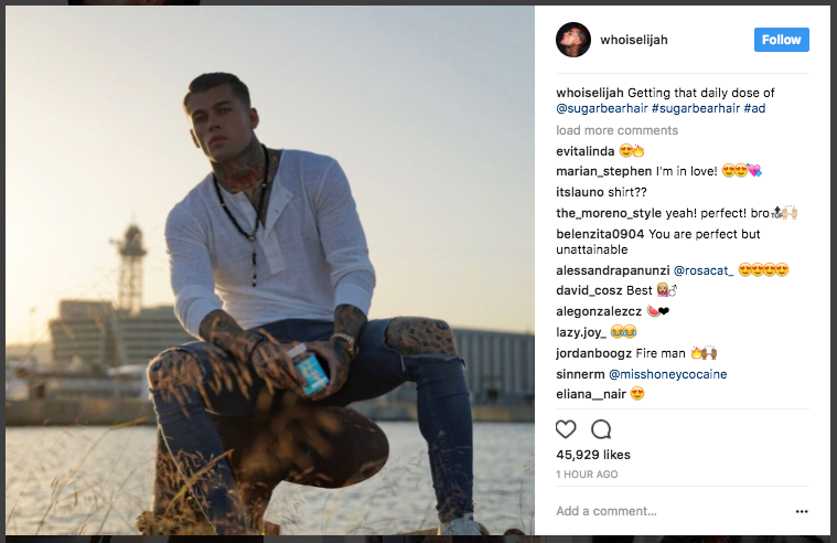 Male model poses in Instagram post, tagging an ad in the description. Tons of positive/supportive comments beneath