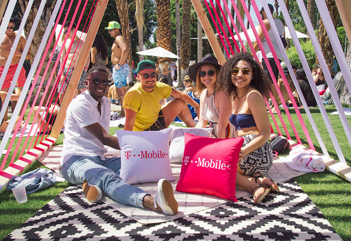 T-Mobile branded gathering with people relaxing in the sun