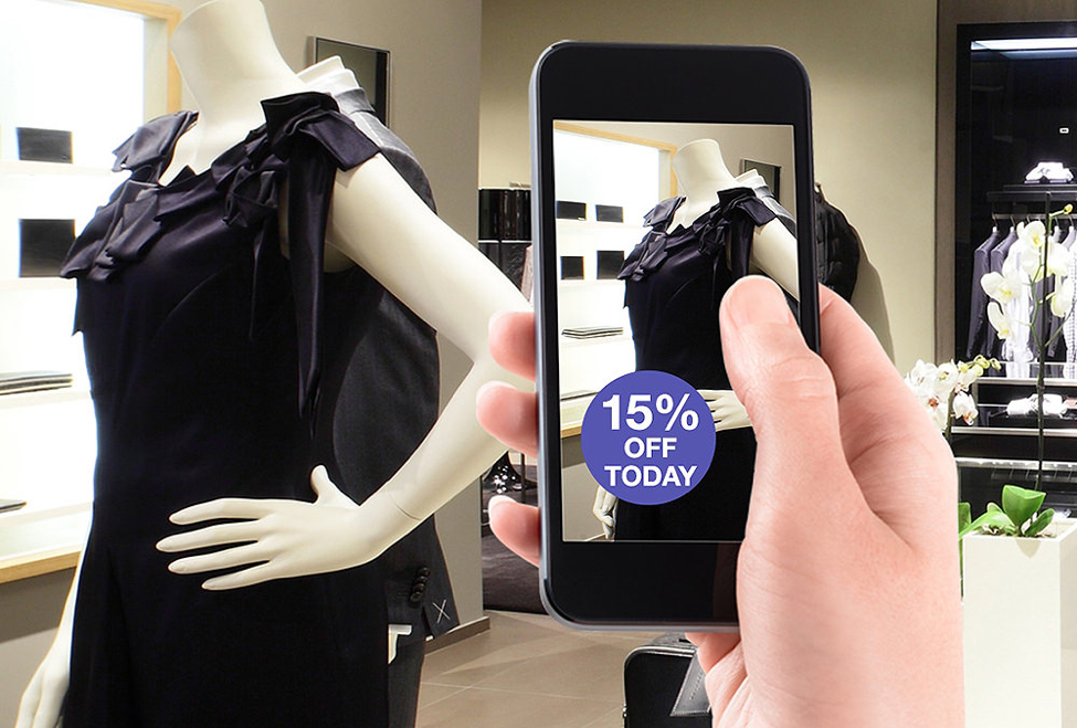 A phone holding a picture of a dress with a tag reading "15% off today!"
