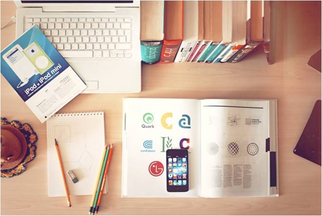 Work desk with books and a laptop