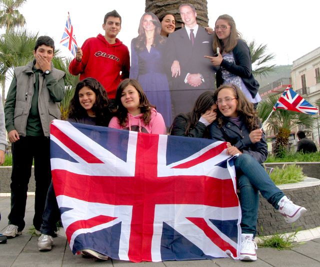 Students of one of our teachers posing next to the royals