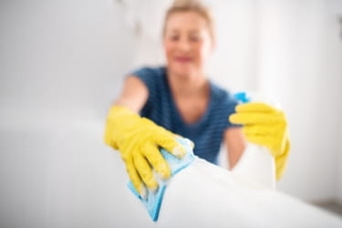 Woman wiping the tub