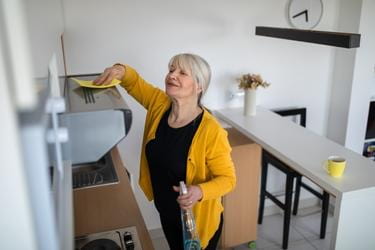 Woman cleaning her kitchen