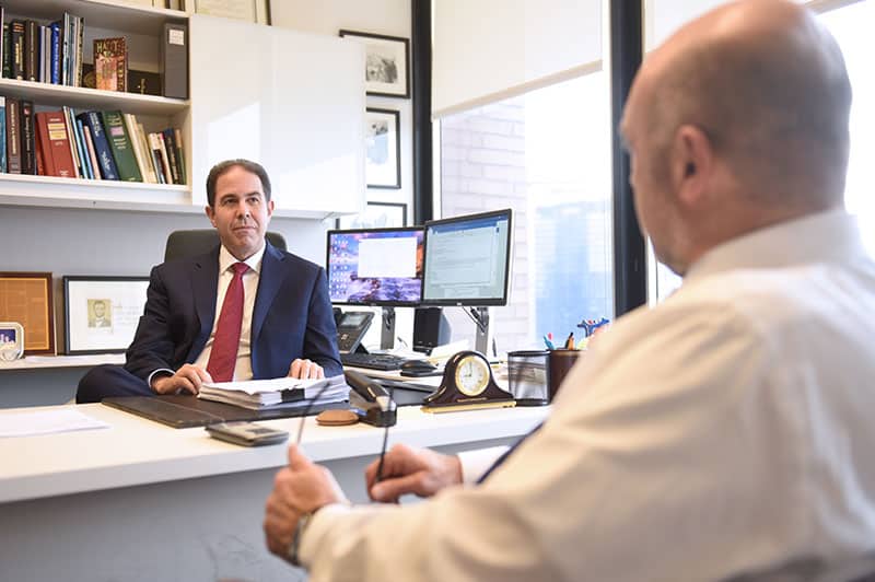 Bradley Zimmerman at Jacob Fuchsberg Law Firm office