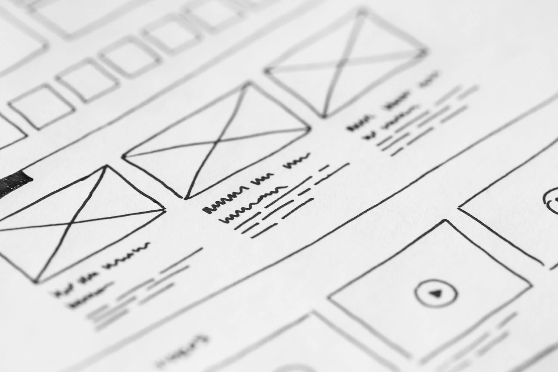 Black and white wireframe drawings for a website