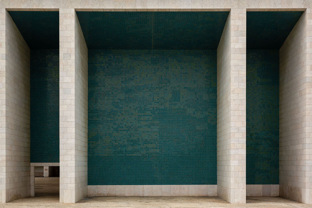 Turquoise and white tiled facade.