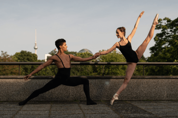 A couple of ballet dancers performing outdoors in Berlin.