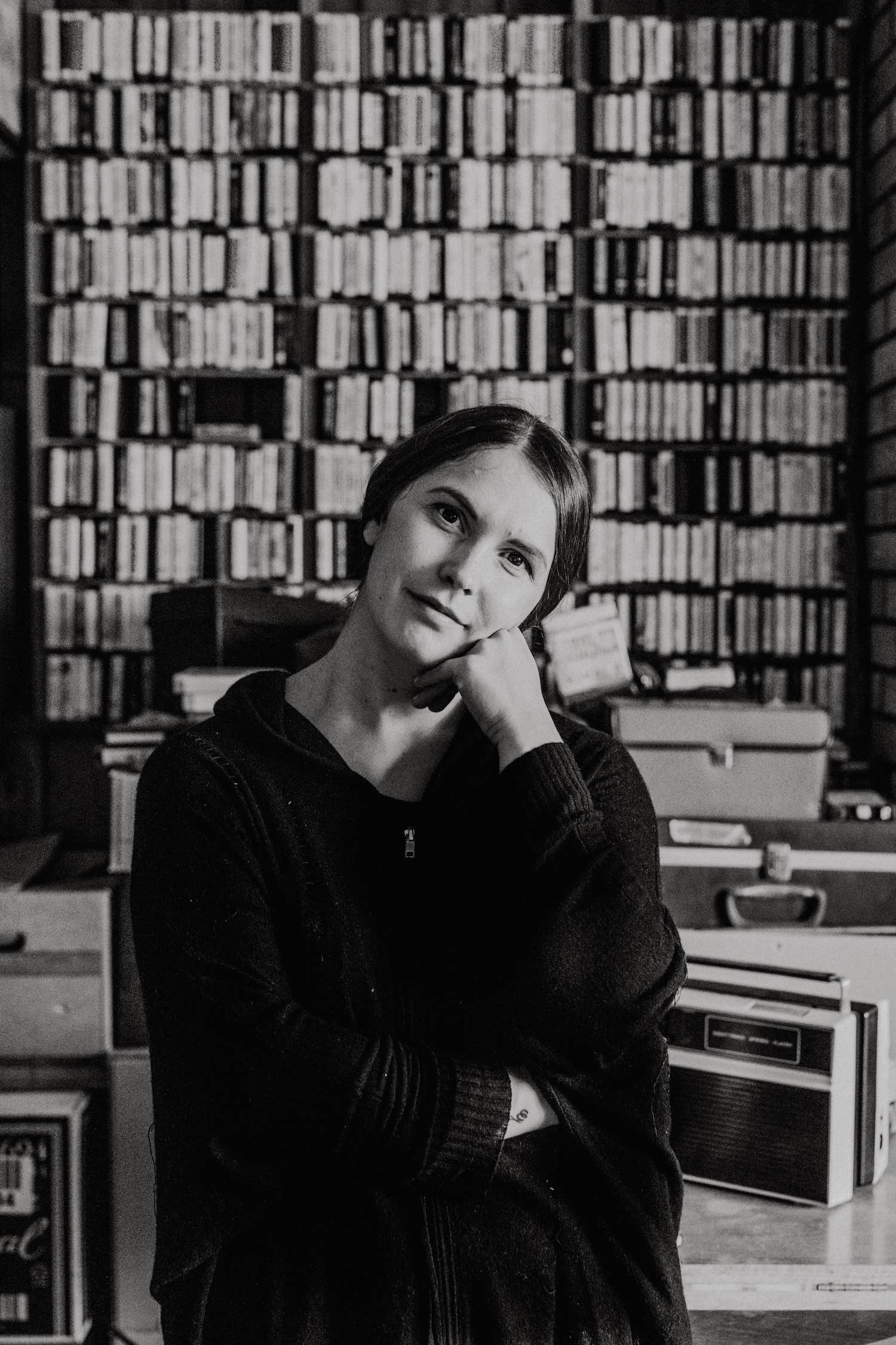 A thoughtful girl in a library.