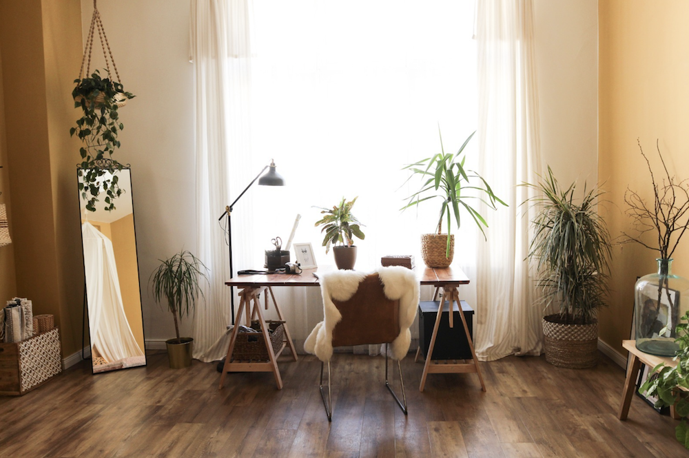 Living room and desk of a scandinavian apartment available for rent for your next shooting in Berlin, Germany. Original and unique interior design and style, very bright for photoshoot