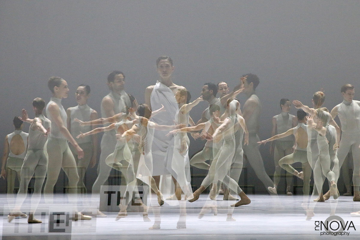 A double exposure image showing a group of dancers on a stage.
