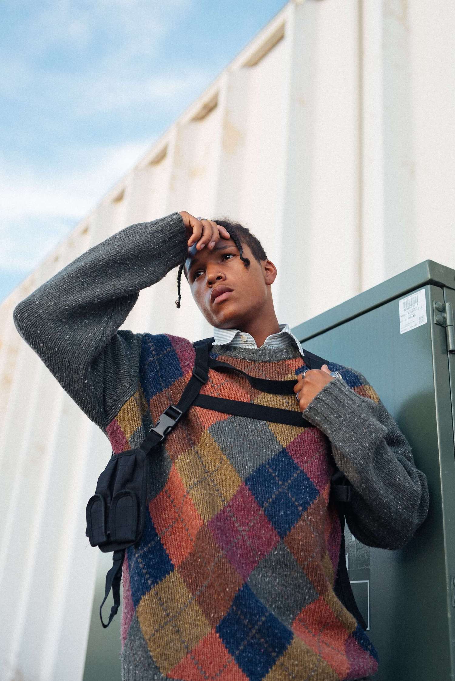 Male model wearing a diamonds jumper.