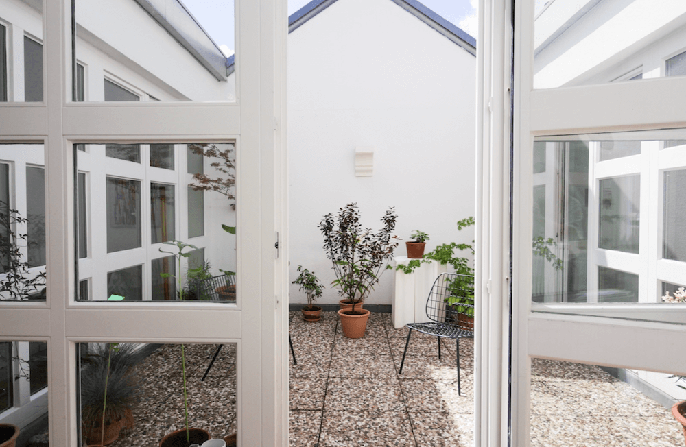 Rooftop garden apartment in architect building, available to rent as a film location in Berlin, Germany. Extremely bright for photoshoots