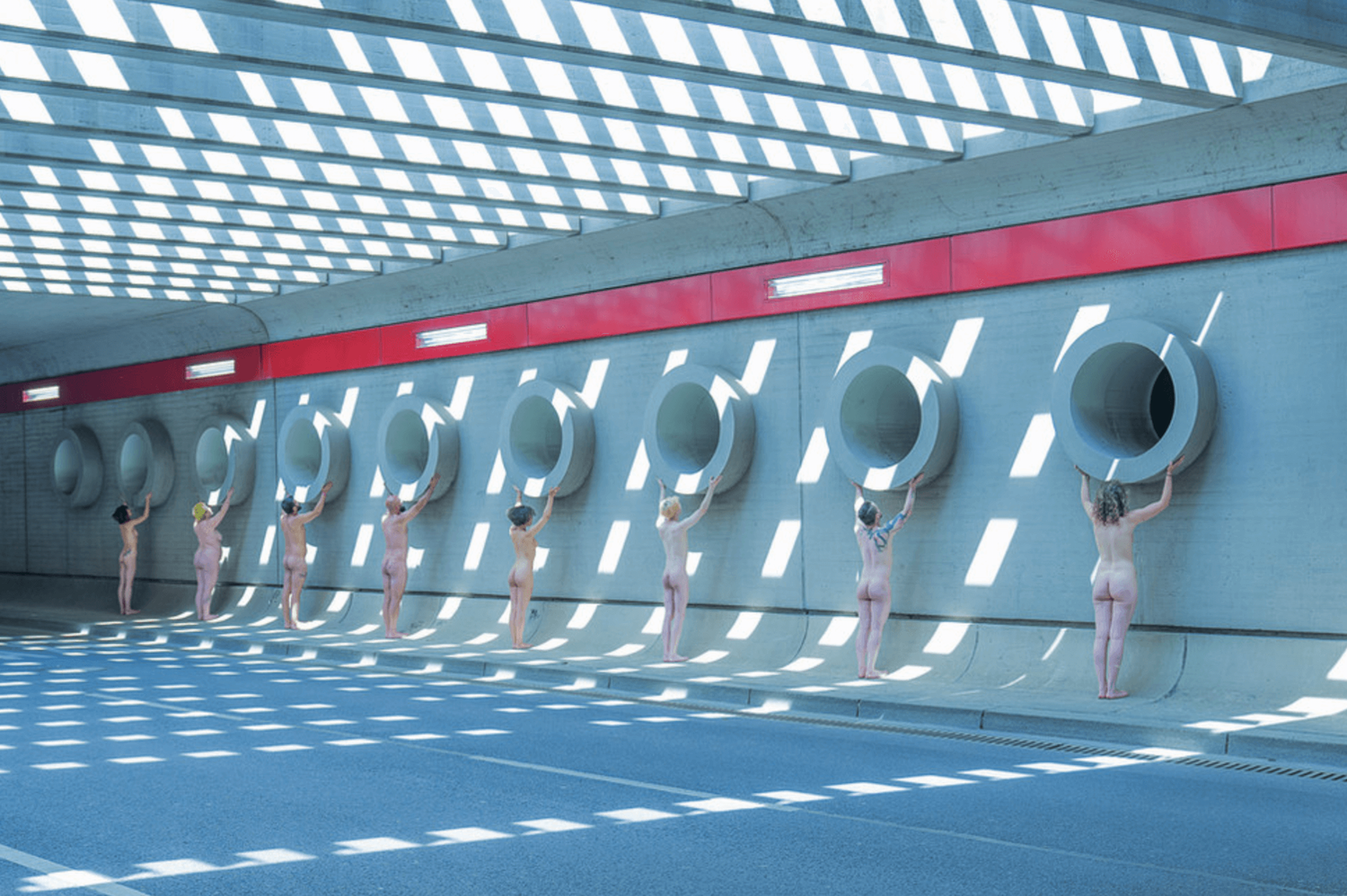 Naked models, indoors architecture, sunlight