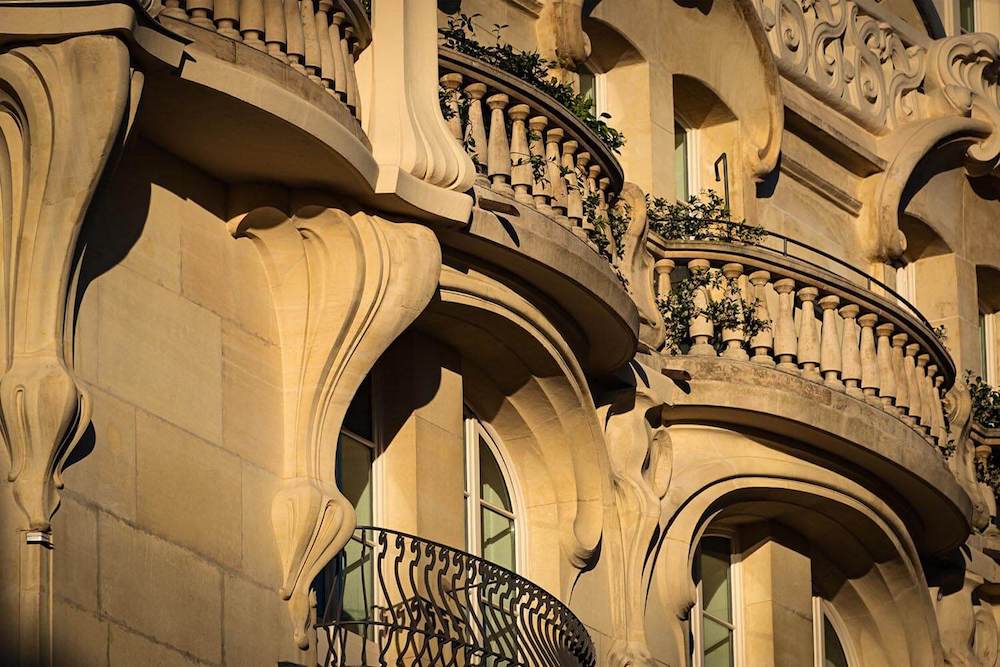 Facade of a building with Romanesque-style balconies.