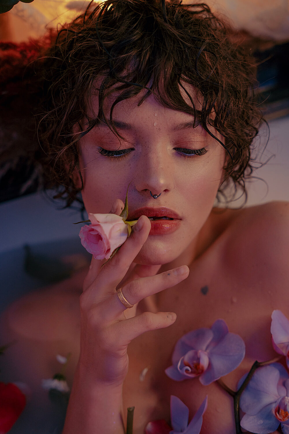 Portrait of a girl in a bath with roses and flowers by photographer Krystsyna Shyla