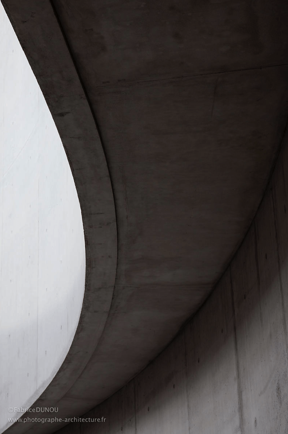 Interior of a grey minimalist building.