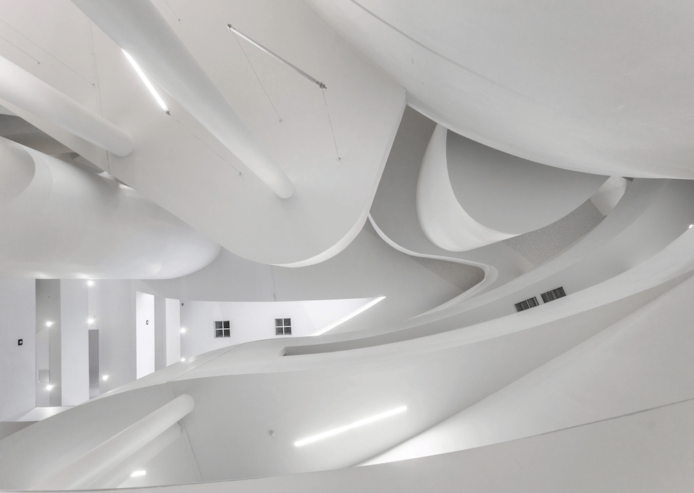 Interior of an all-white modernist building.