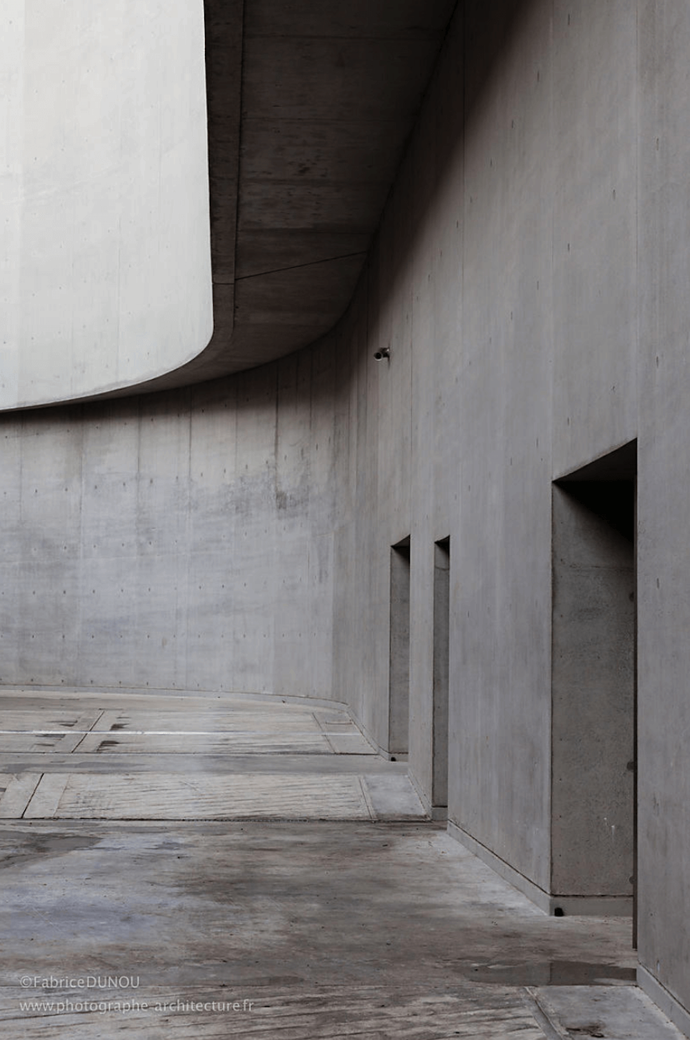 Interior of a grey minimalist building.