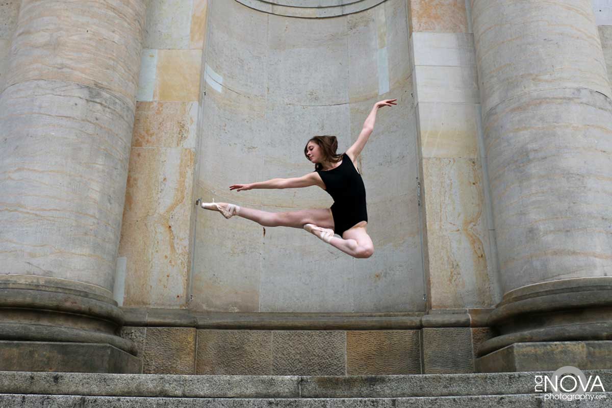A ballet dancer doing a dance leap.