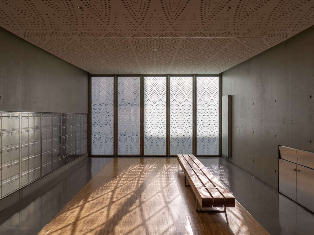 Interior of a bright room with plenty of lockers.