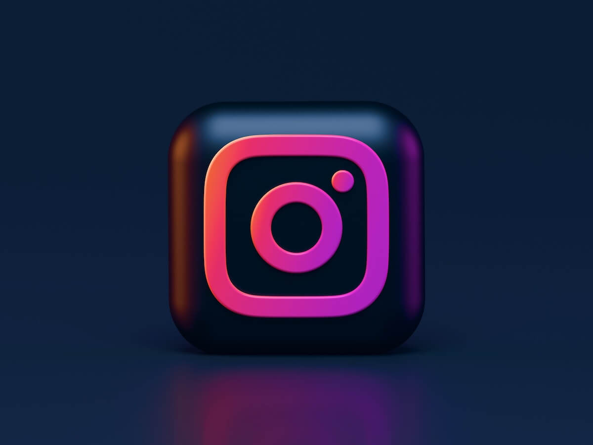 Instagram logo on dark background.