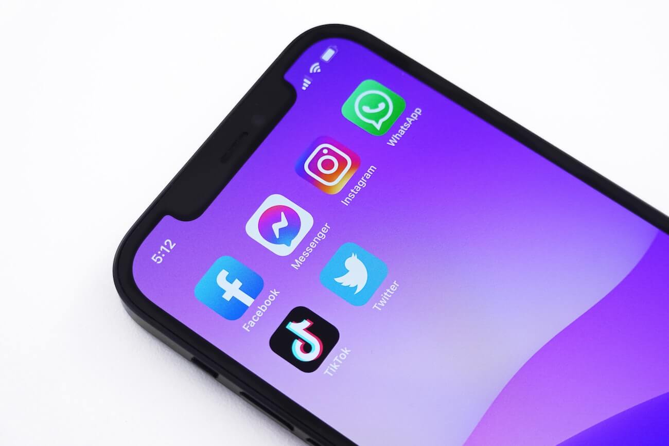 Promoting video content on social media, an Iphone mockup with the main social media apps on screen.