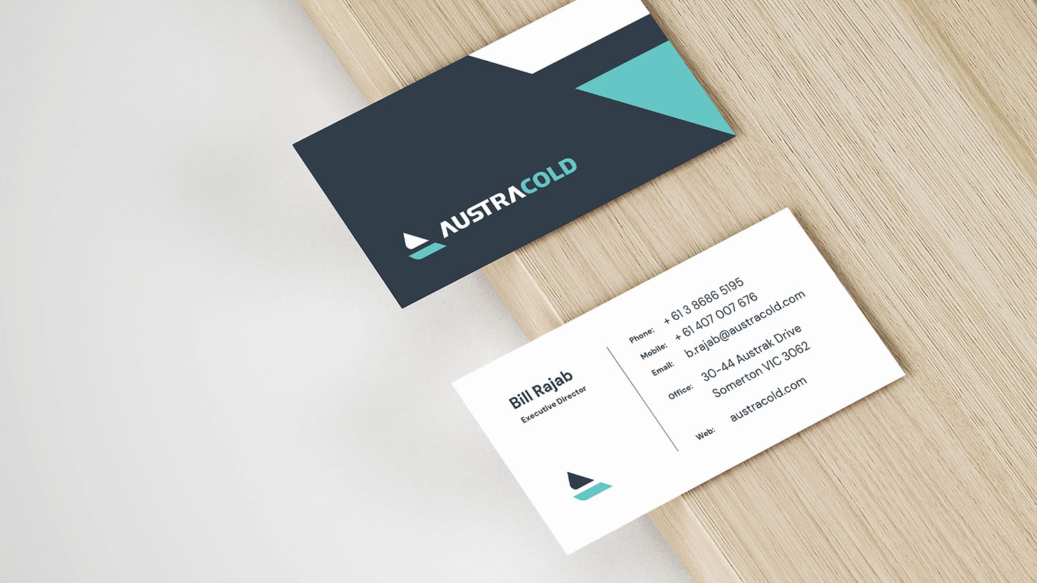 AustraCold business cards spread on a table