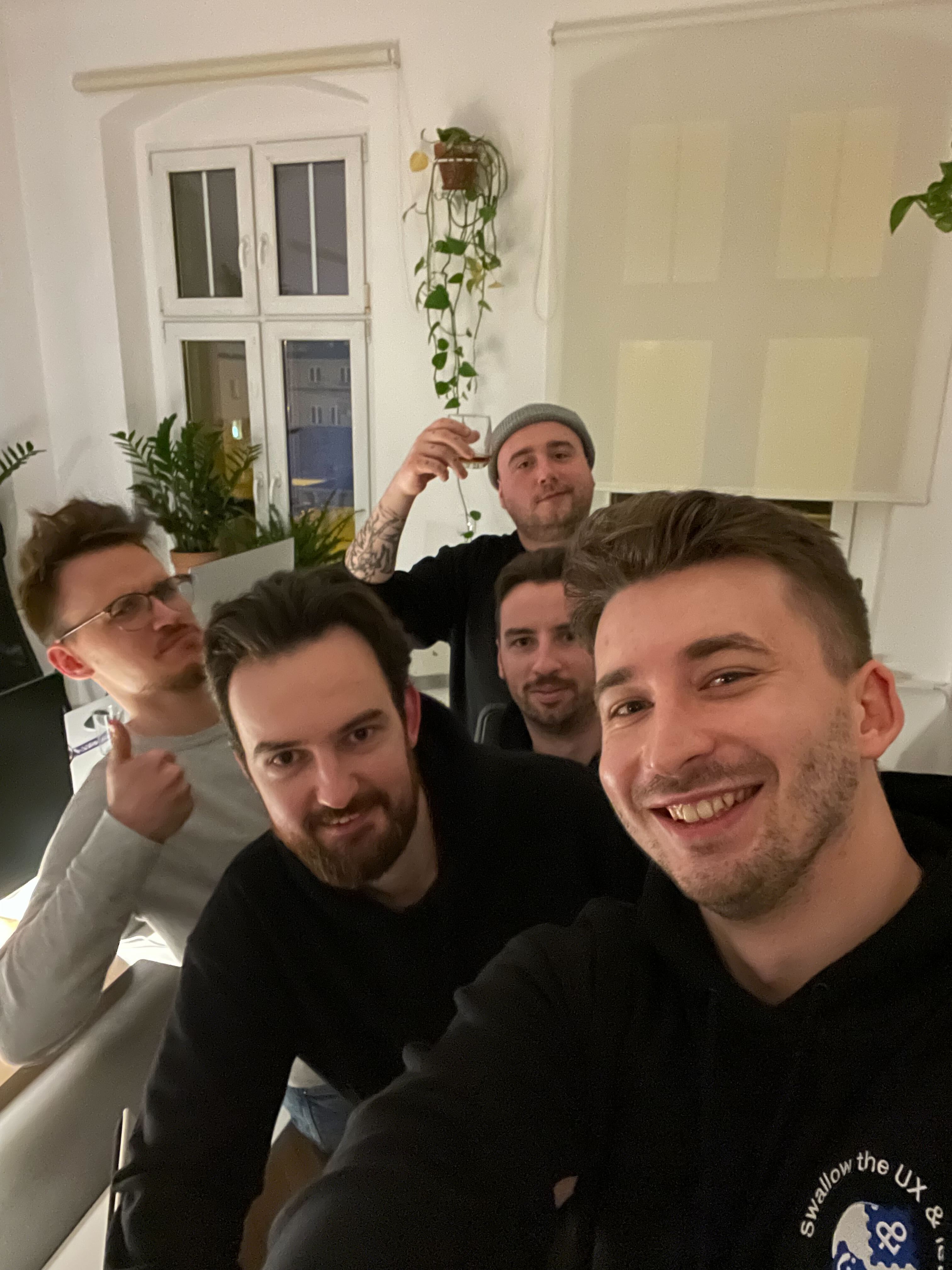 The hackathon taking a selfie, smiling.