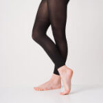 A woman demonstrating wearing senior and advanced modern and tap tights
