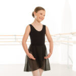 A girl demonstrates the senior and advanced black wrapover skirt