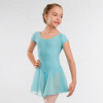 A girl demonstrating the blue tots and infant leotard