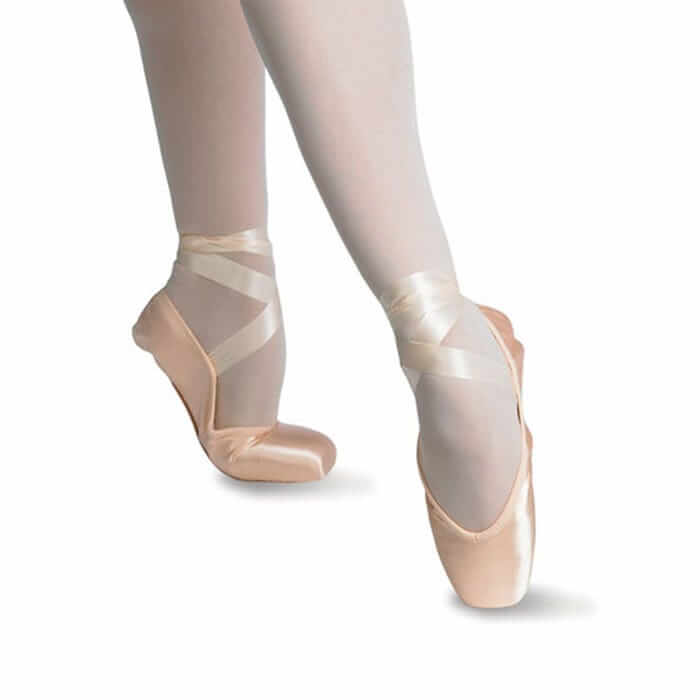 A girl demonstrating wearing soft demi pointe shoes