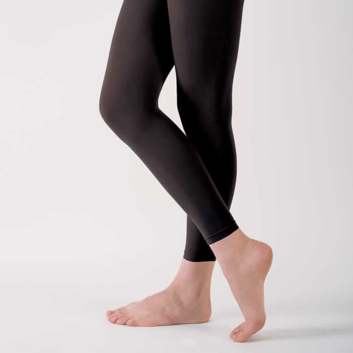 A girl demonstrating wearing junior modern and tap tights