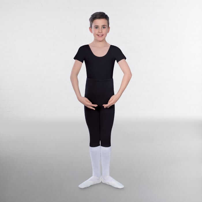 A boy demonstrating wearing a senior and advanced boys' leotard