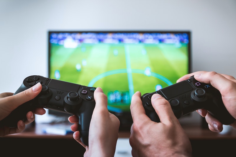 Two boys are playing video games.