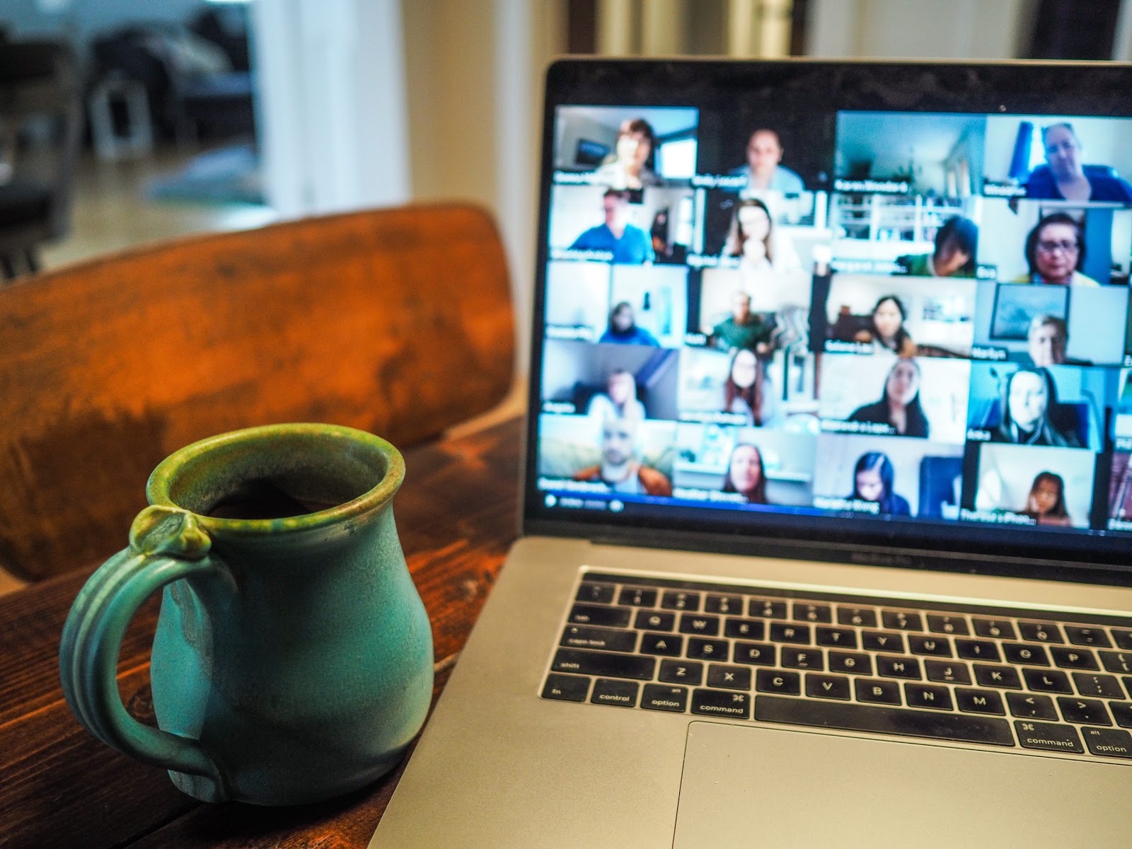 A virtual support group takes place on someone's laptop.