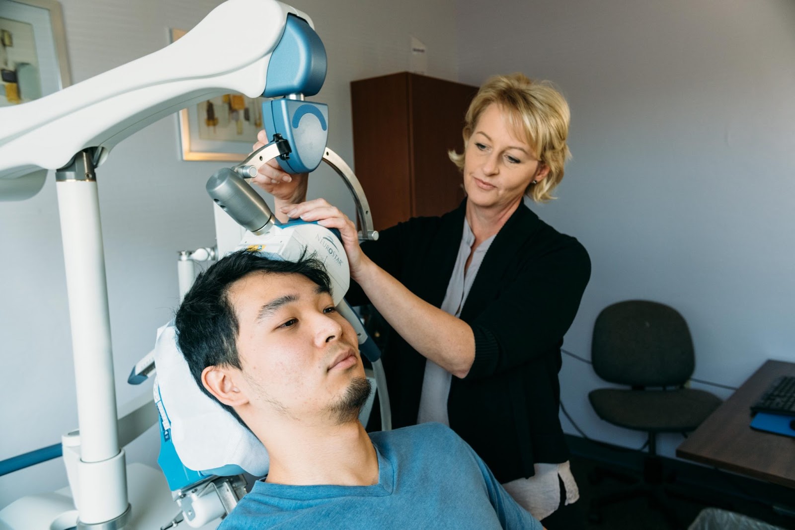 Technician administers TMS to patient