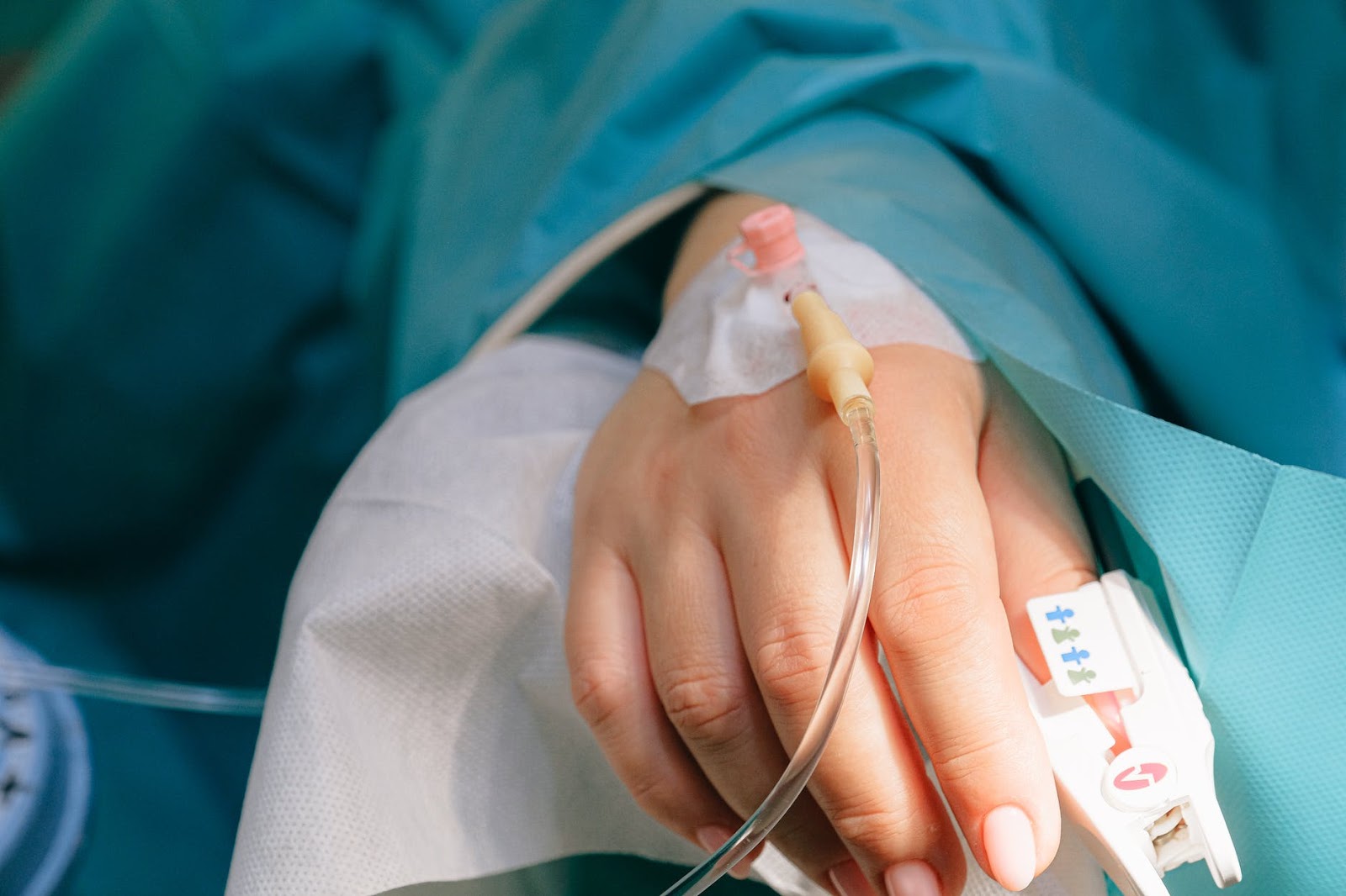 A hand with an IV inserted in it