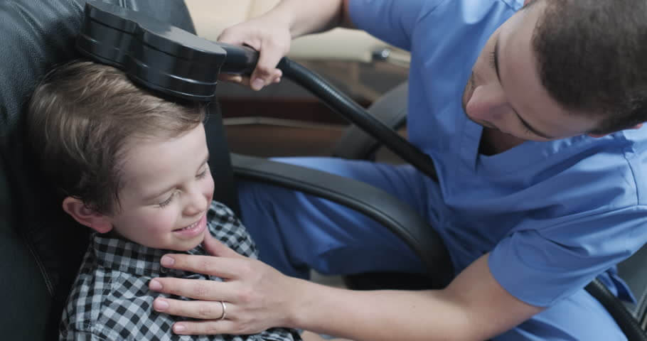 child getting tms treatment