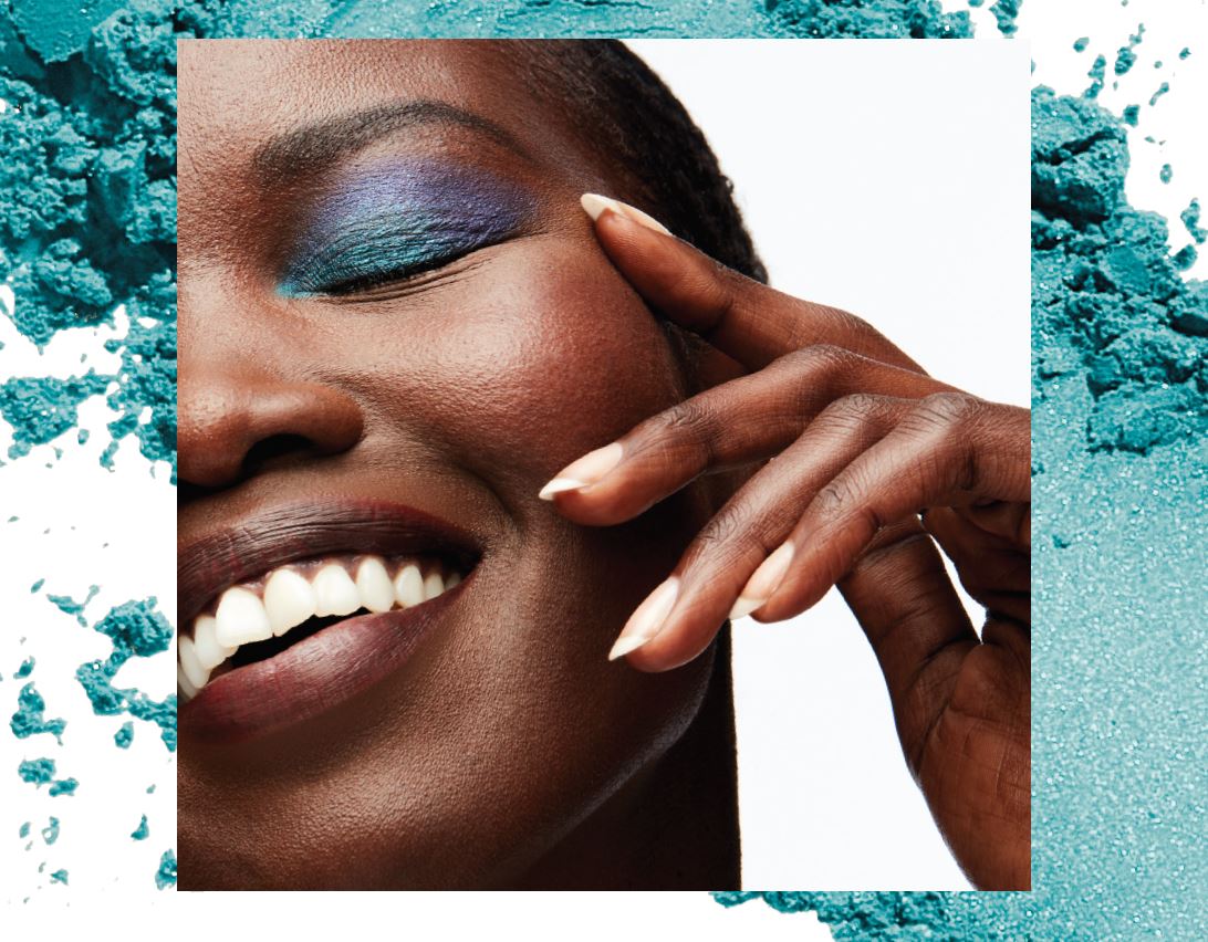 Smiling woman with blue eyeshadow