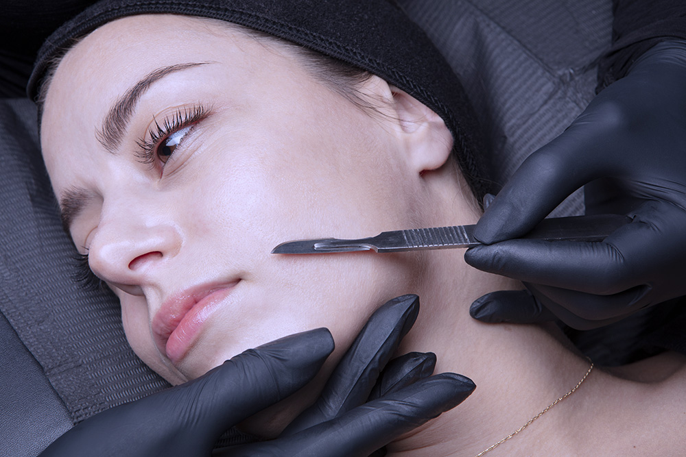 Woman receiving dermaplaning service