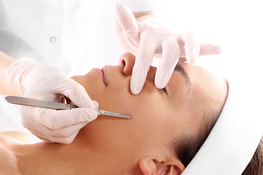 Woman receiving dermaplaning service